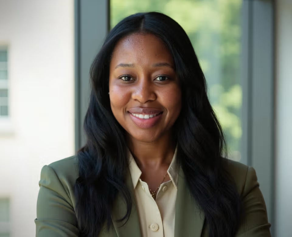 Dr. Shadae Person smiling in a green blazer